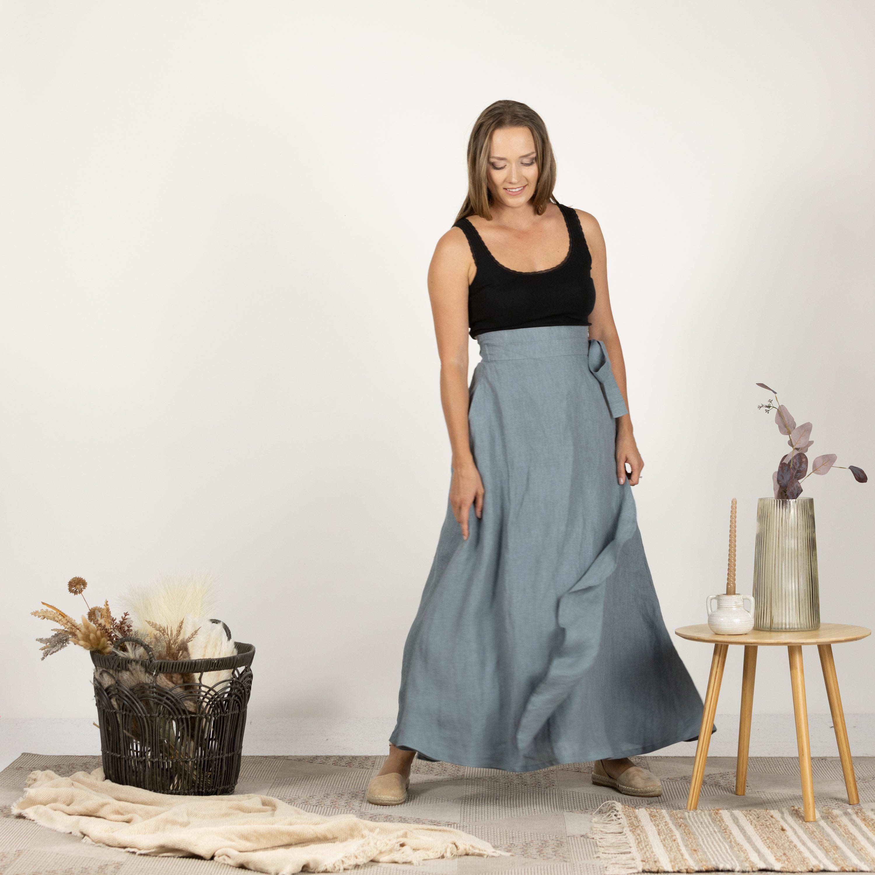 Model in the Linen Wrap Around Skirt with Tie, front view capturing the skirt's flowing and airy fabric.