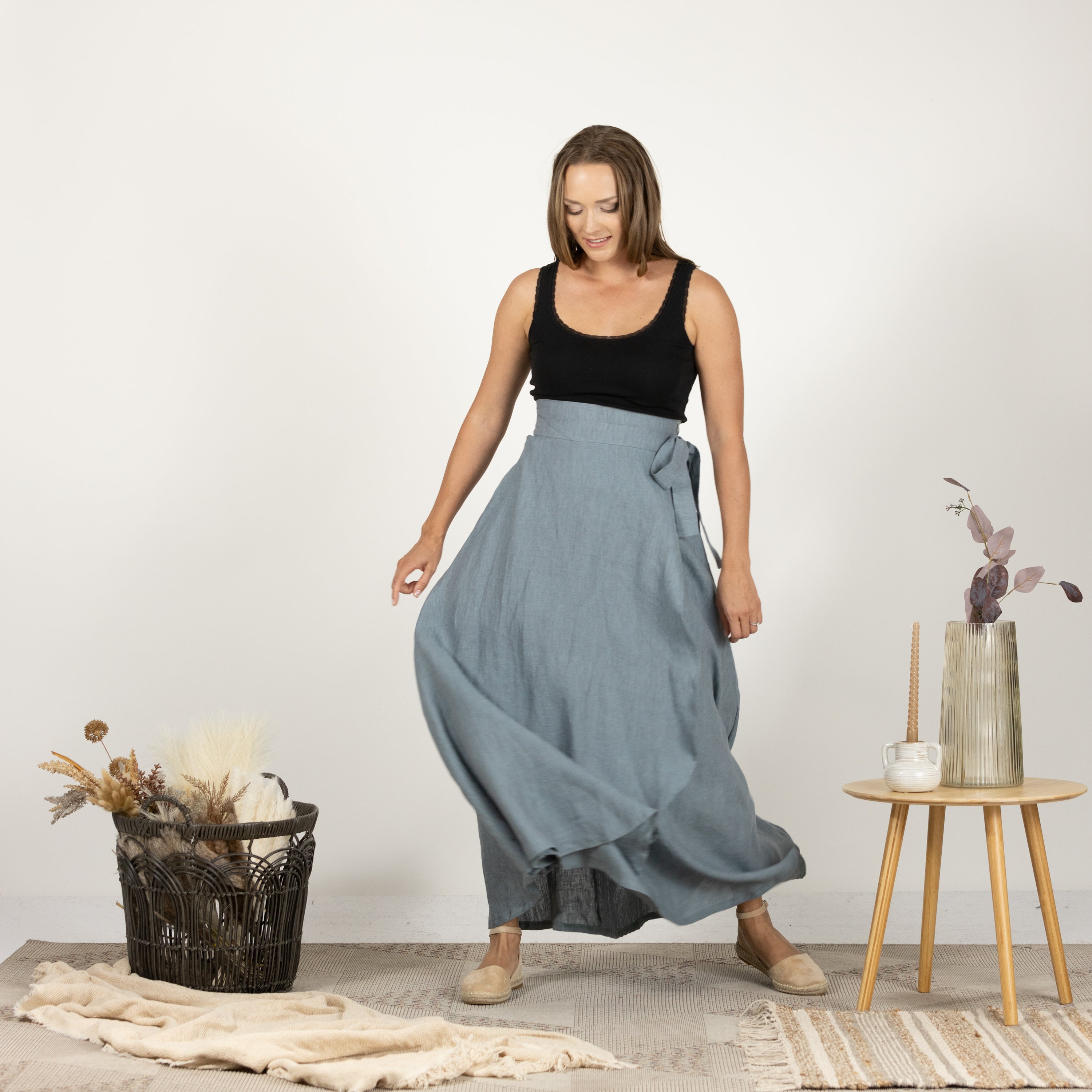 Model in the front view of the Linen Wrap Around Skirt with Tie, highlighting the flattering silhouette and elegant style.