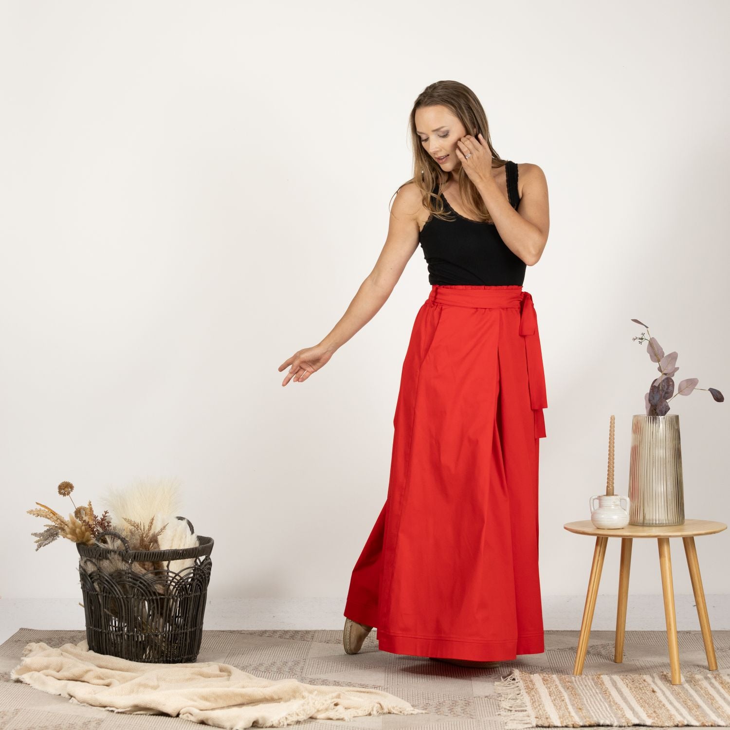 Model presenting the front of the Cascading Cotton Skirt with Pockets, emphasizing the high-quality cotton fabric