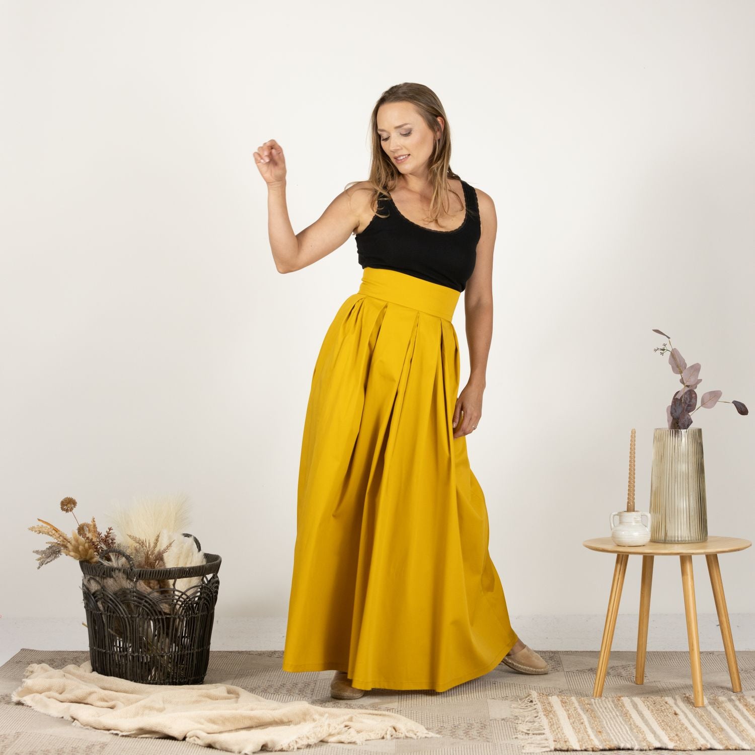 Model displaying the front of the Cotton Skirt with High Rise, highlighting its breathable cotton fabric and timeless look.