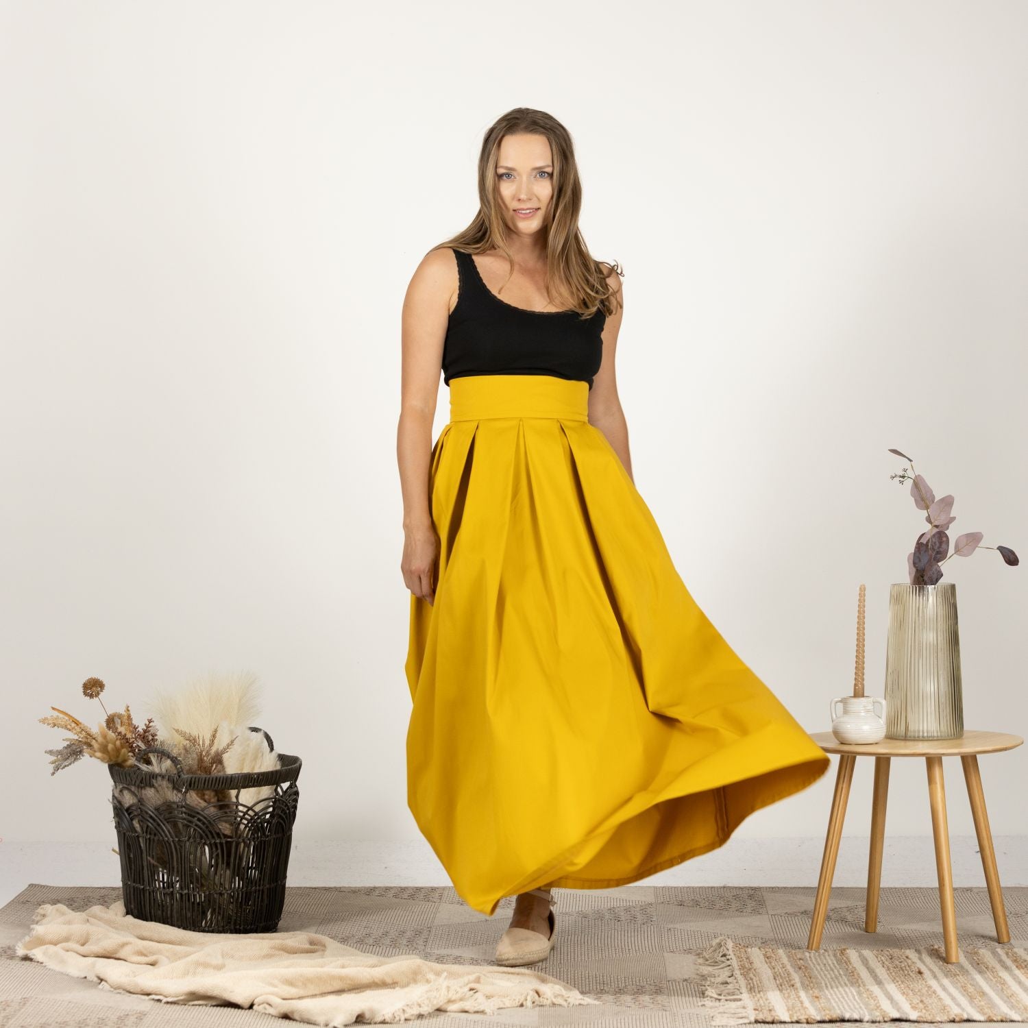 Model in the front view of the Cotton Skirt with High Rise, highlighting the minimalist and flattering fit.