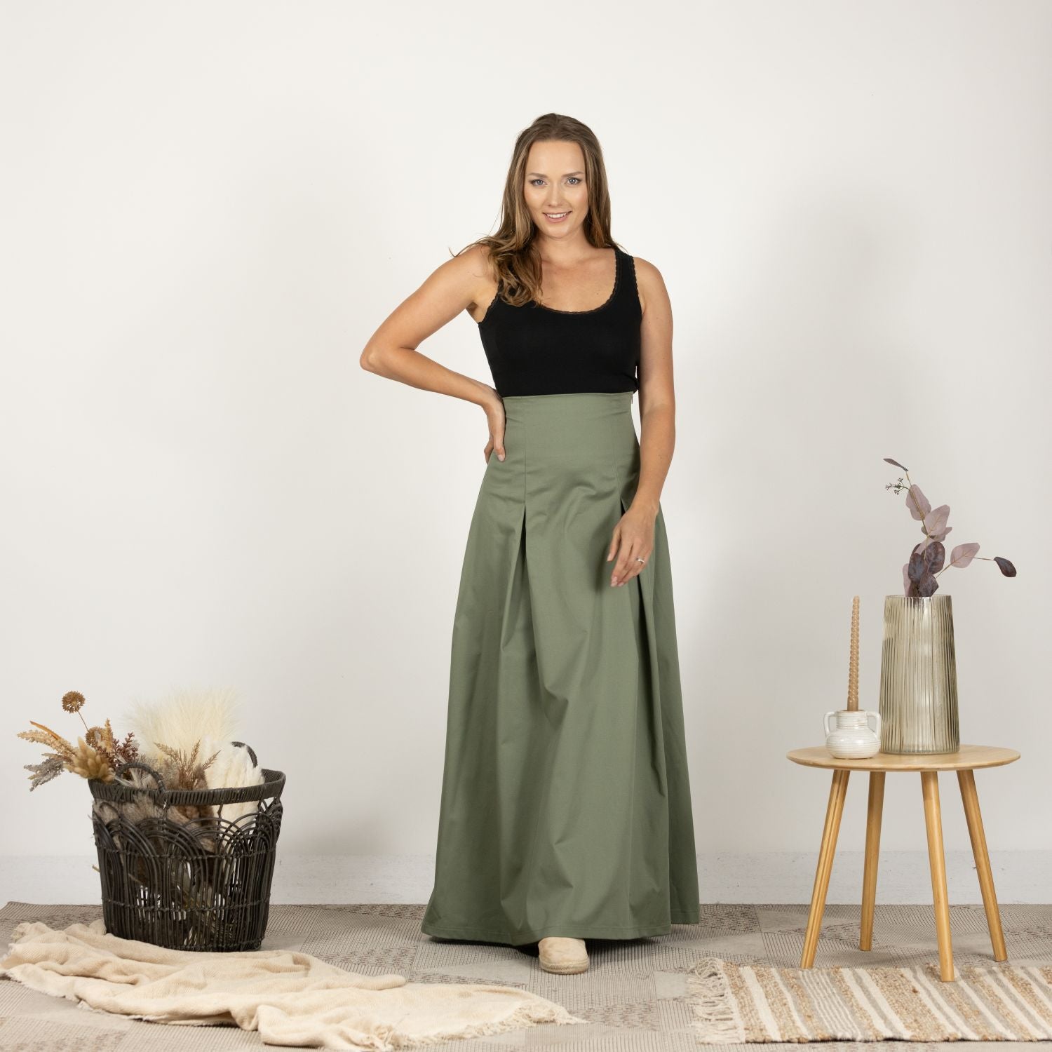 Front view of model wearing the Ultra High-Waist Cotton Skirt, showcasing its full length and ultra high waist design.