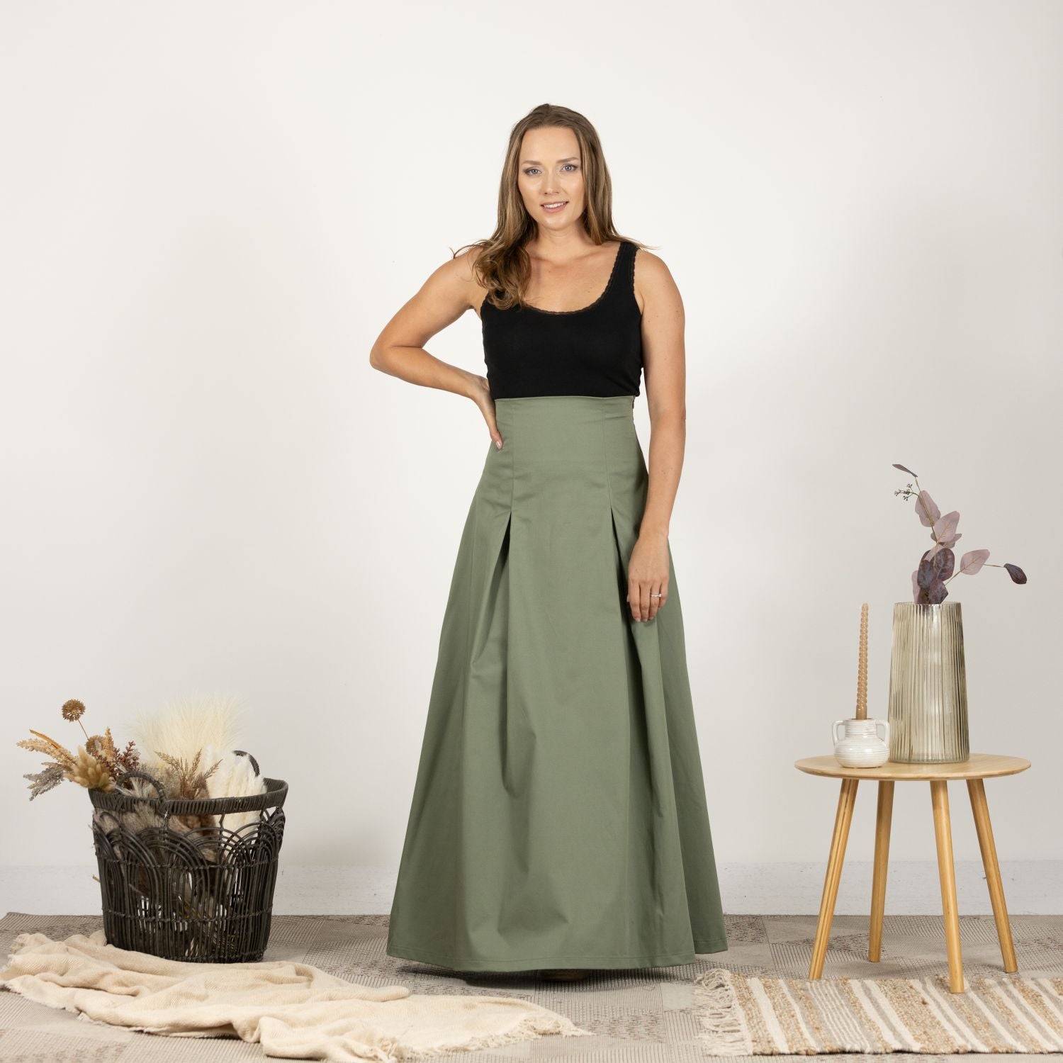 Model in the Ultra High-Waist Cotton Skirt, front view capturing the airy and breathable cotton fabric.