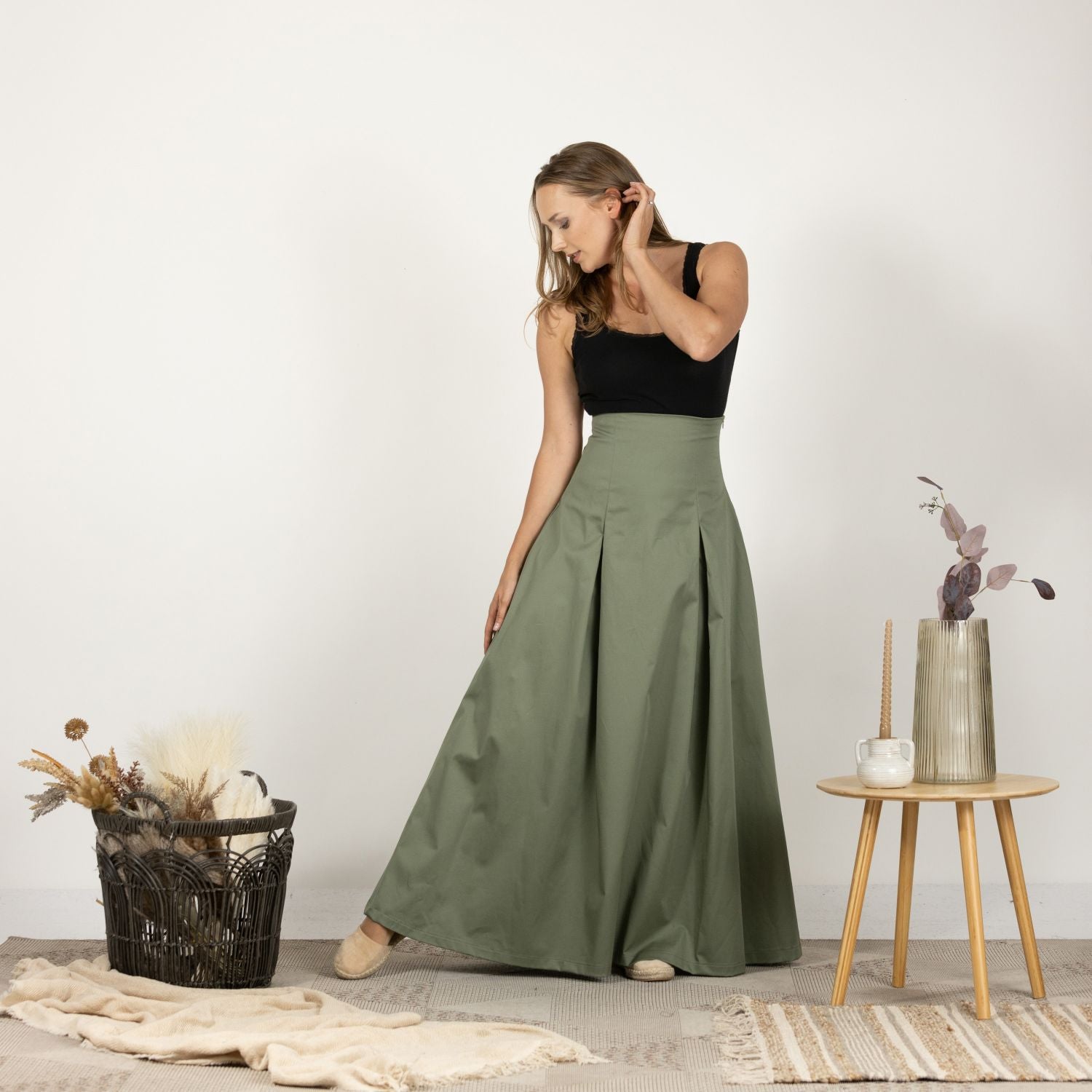 Model wearing the Ultra High-Waist Cotton Skirt from the front, emphasizing the versatile and flattering silhouette.