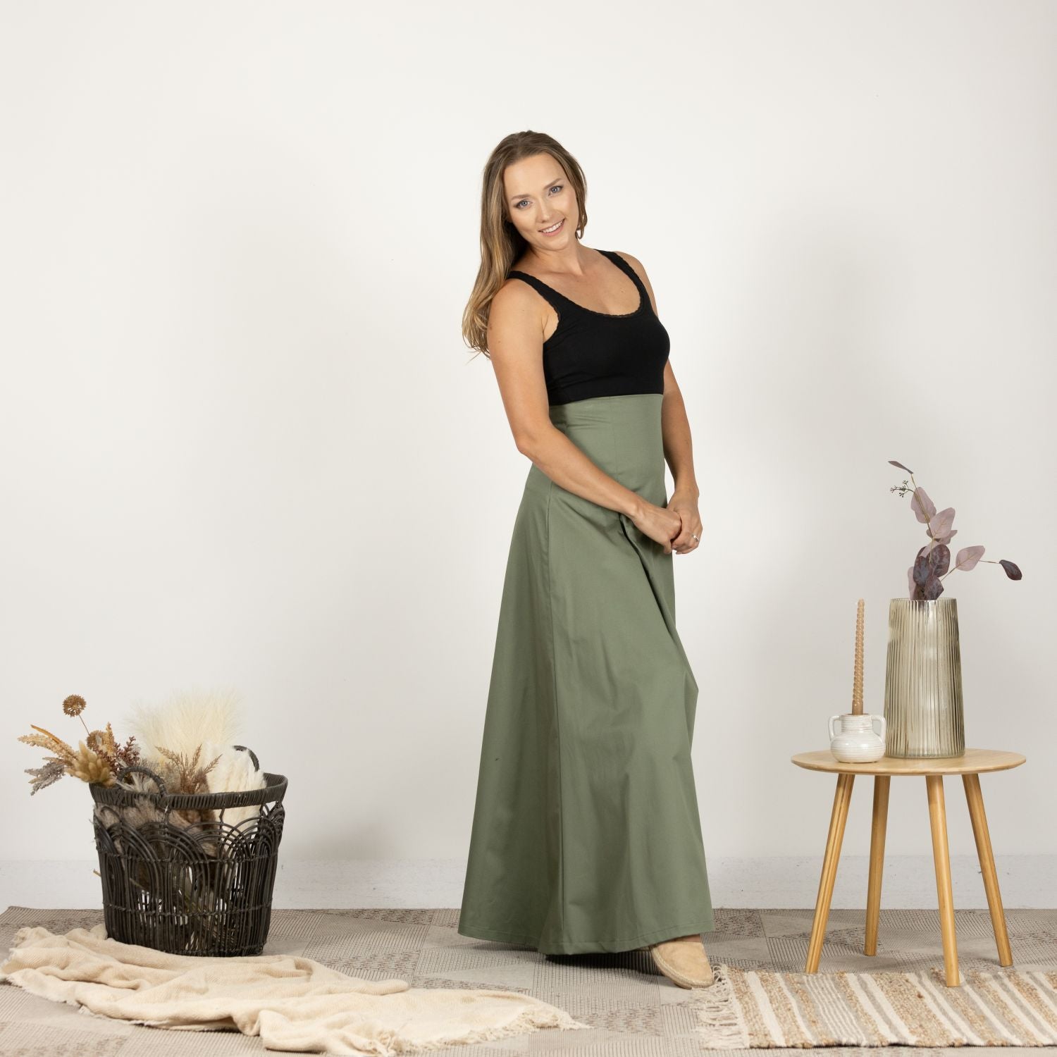 Side view of the model wearing the Ultra High-Waist Cotton Skirt, illustrating the ultra high waist and loose silhouette.