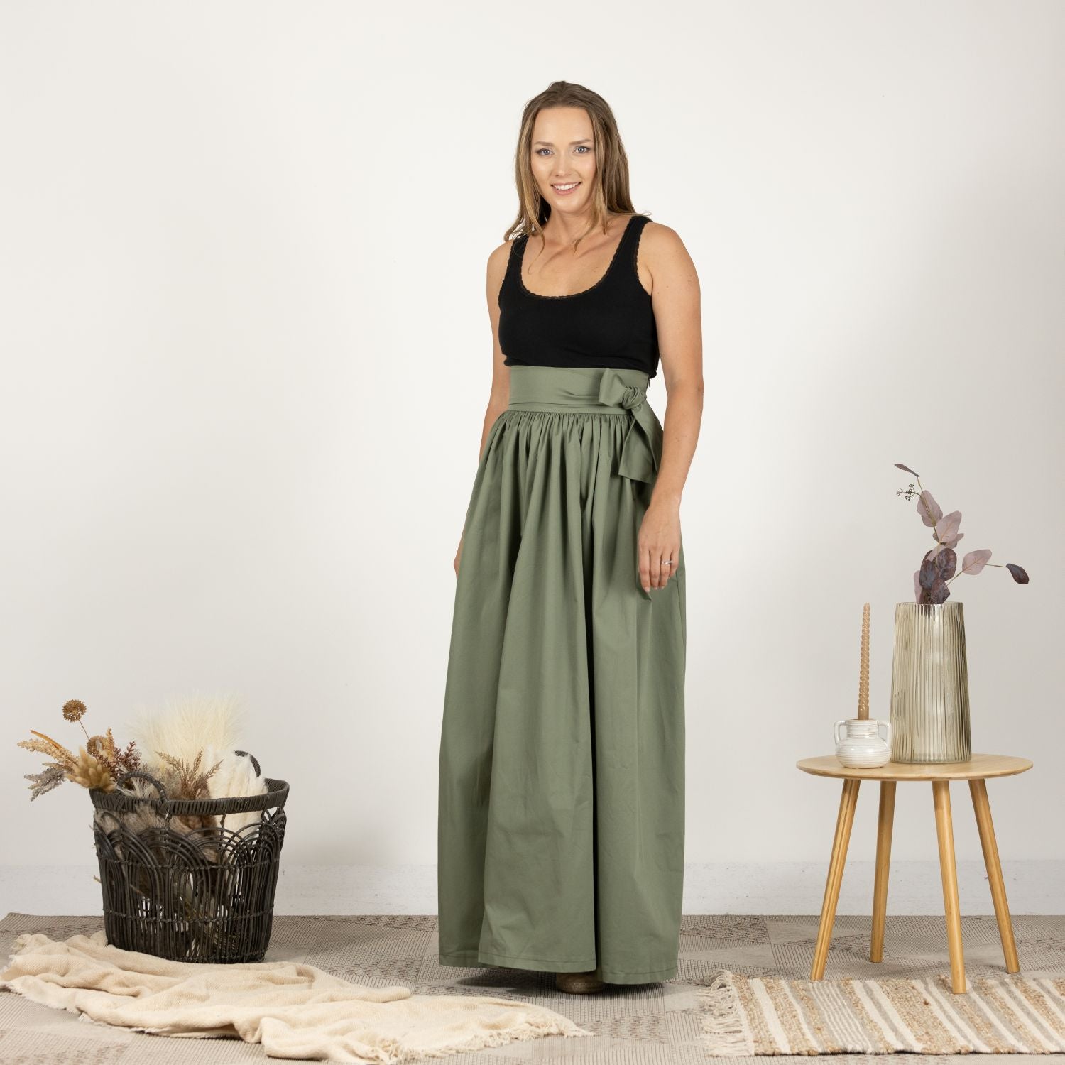 Front view of the Loose High Waist Skirt in Sage Green, featuring a full-length design, soft cotton fabric, and a flattering high waist with a loose fit.