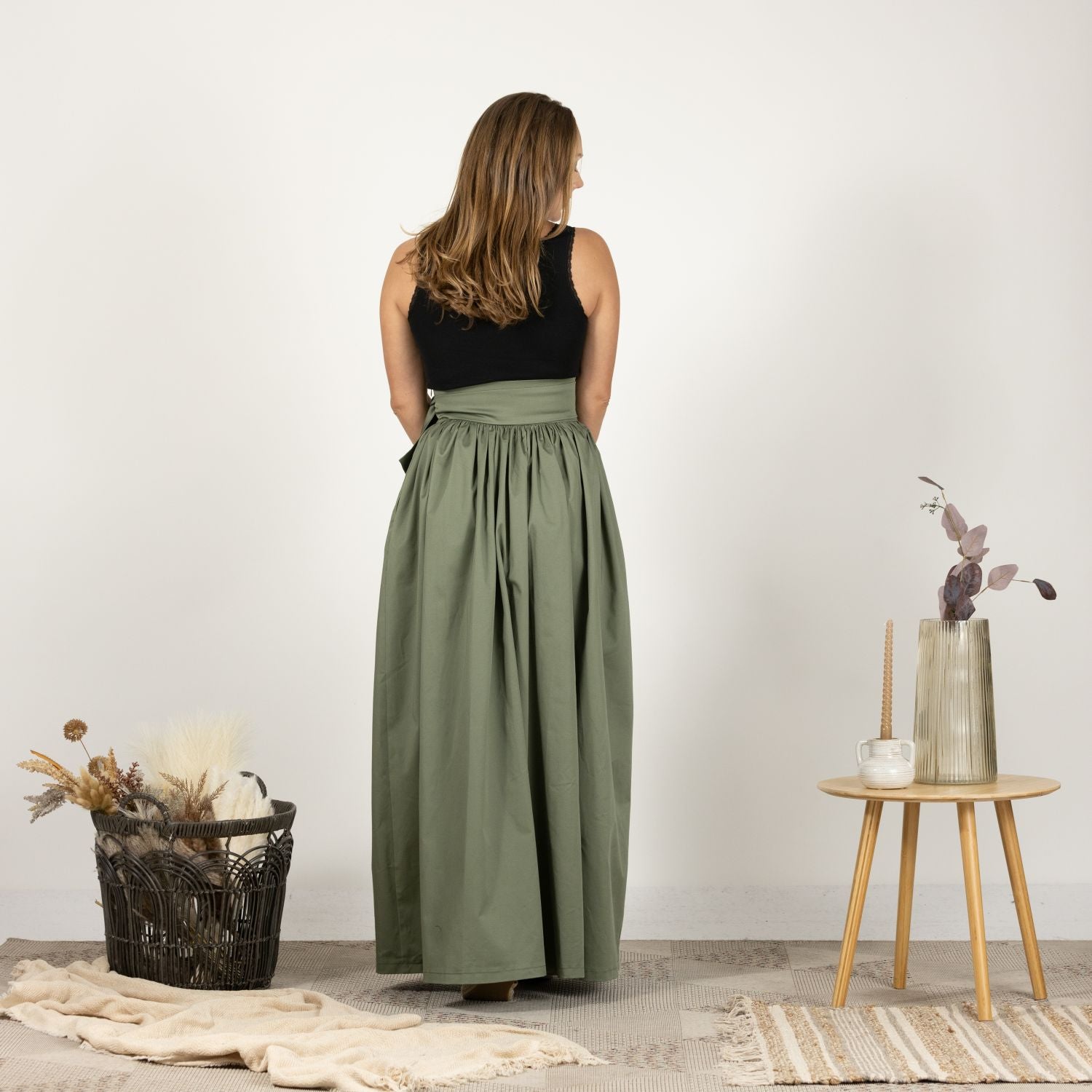 Back view of the Loose High Waist Skirt in Sage Green, highlighting the high waist and flowy, full-length silhouette.