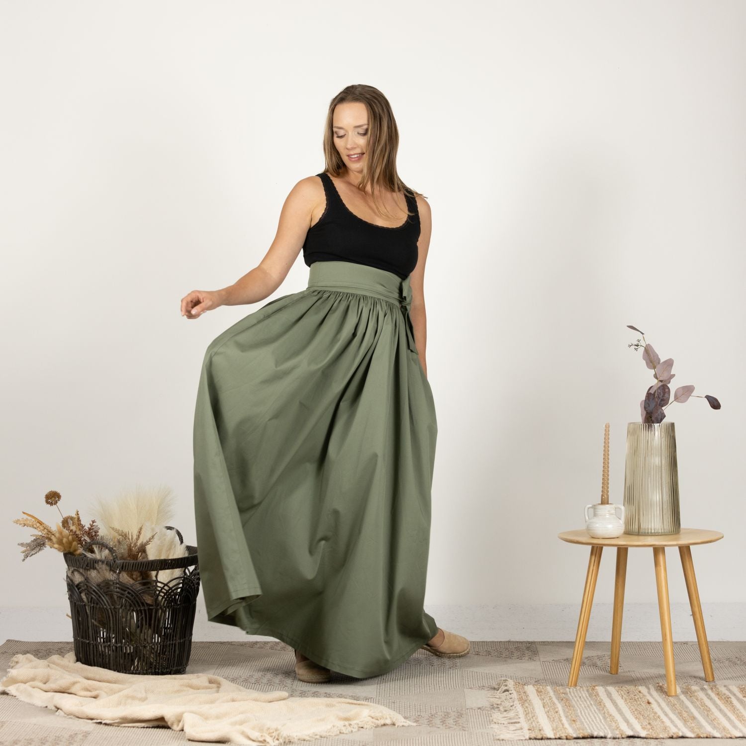 Close-up front view of the Loose High Waist Skirt in Sage Green, emphasizing the soft cotton material and the detailed finish on the waistband.