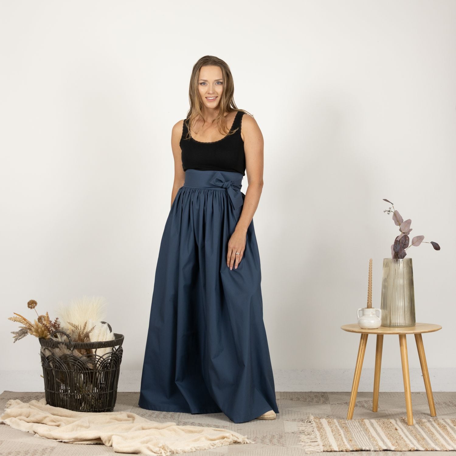 Full-length front view of the Loose High Waist Skirt in Slate Blue, presenting the elegant high waist and the skirt's full, flowing length.