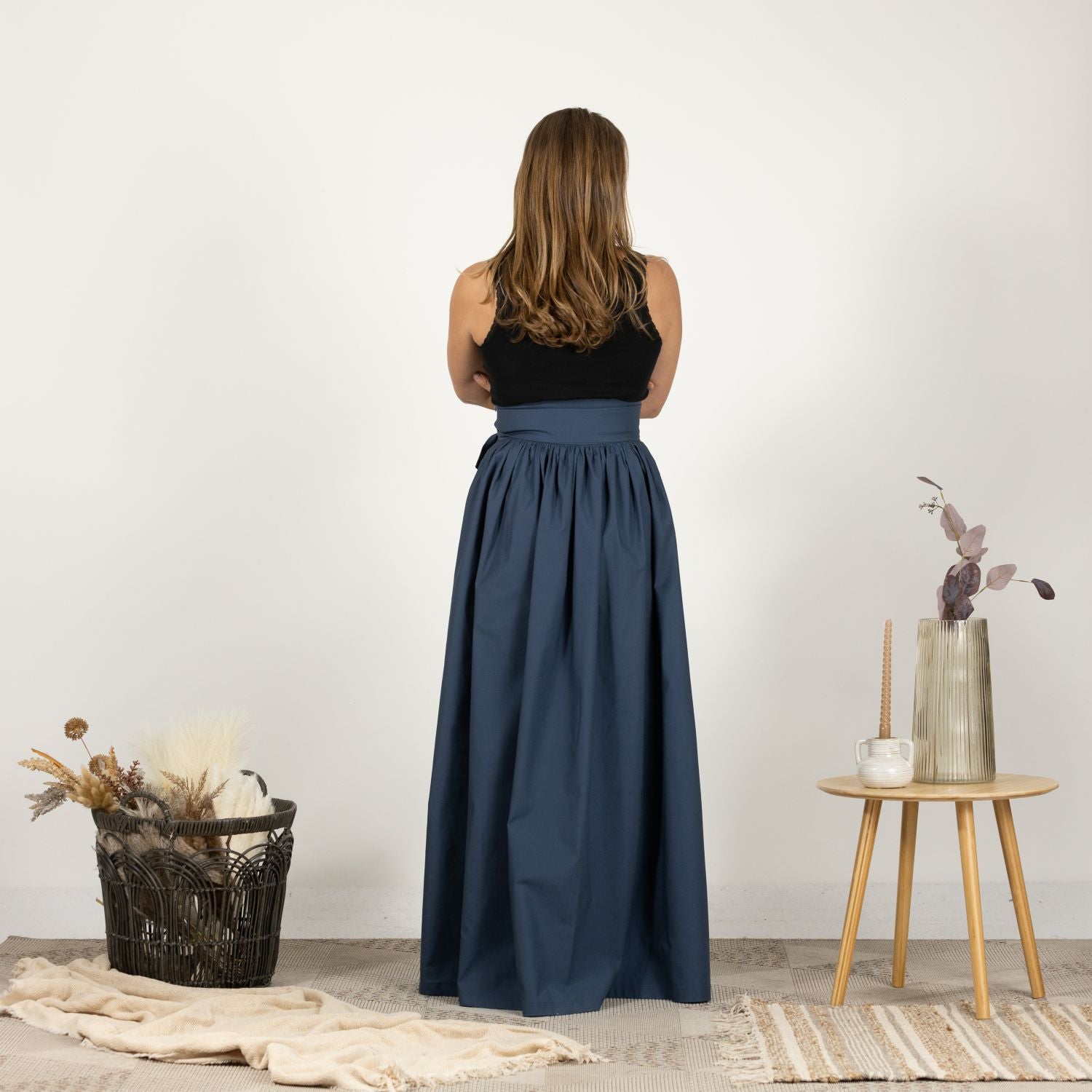 Back view of the Loose High Waist Skirt in Slate Blue, highlighting the high waist and flowy, full-length silhouette.