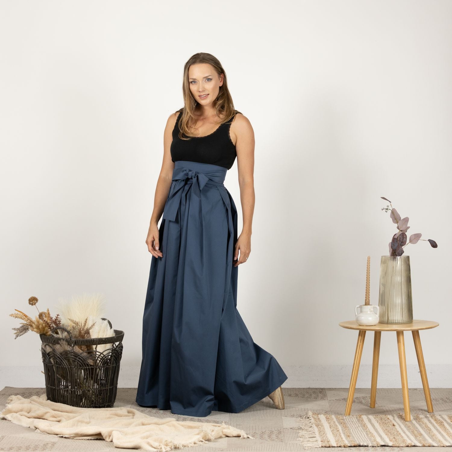 Full-length front view of the High Waist Pleated Maxi Skirt in Slate Blue, displaying the flowing maxi length and the chic high waist.