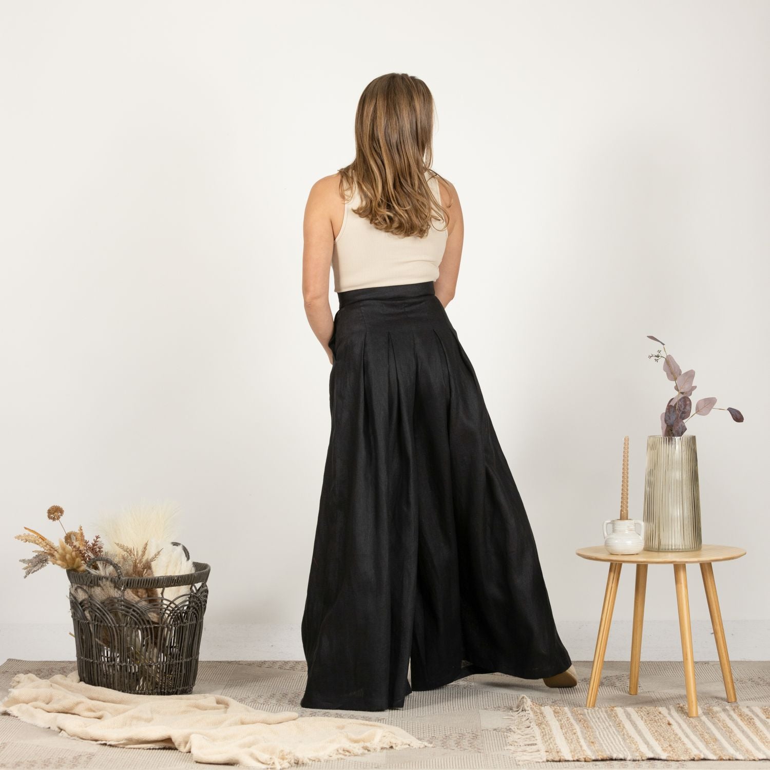 Back view of model in the Lightweight Linen Pants with High Waist, showing the full length and relaxed fit.