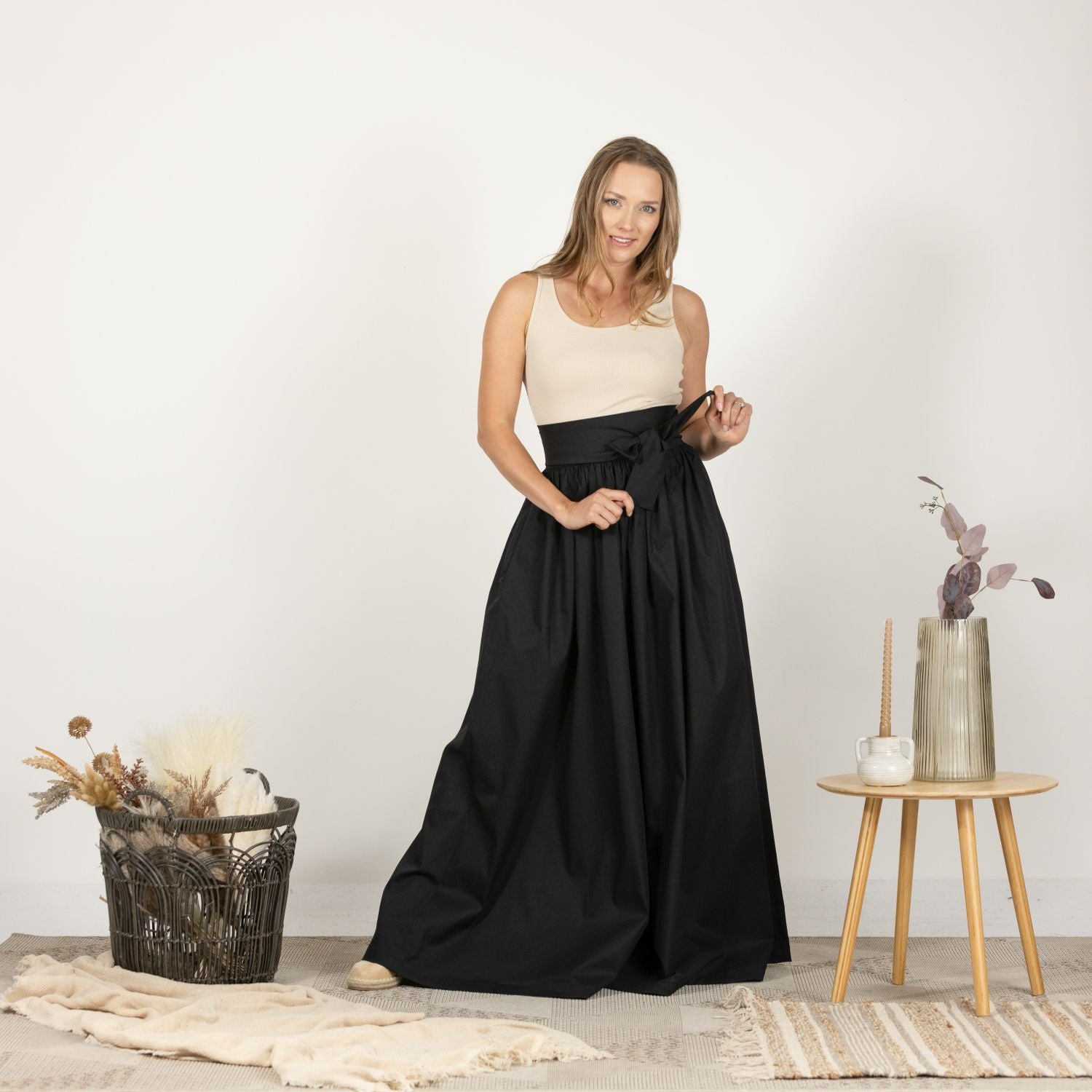 Front view of the Loose High Waist Skirt in Black, featuring a full-length design, soft cotton fabric, and a flattering high waist with a loose fit