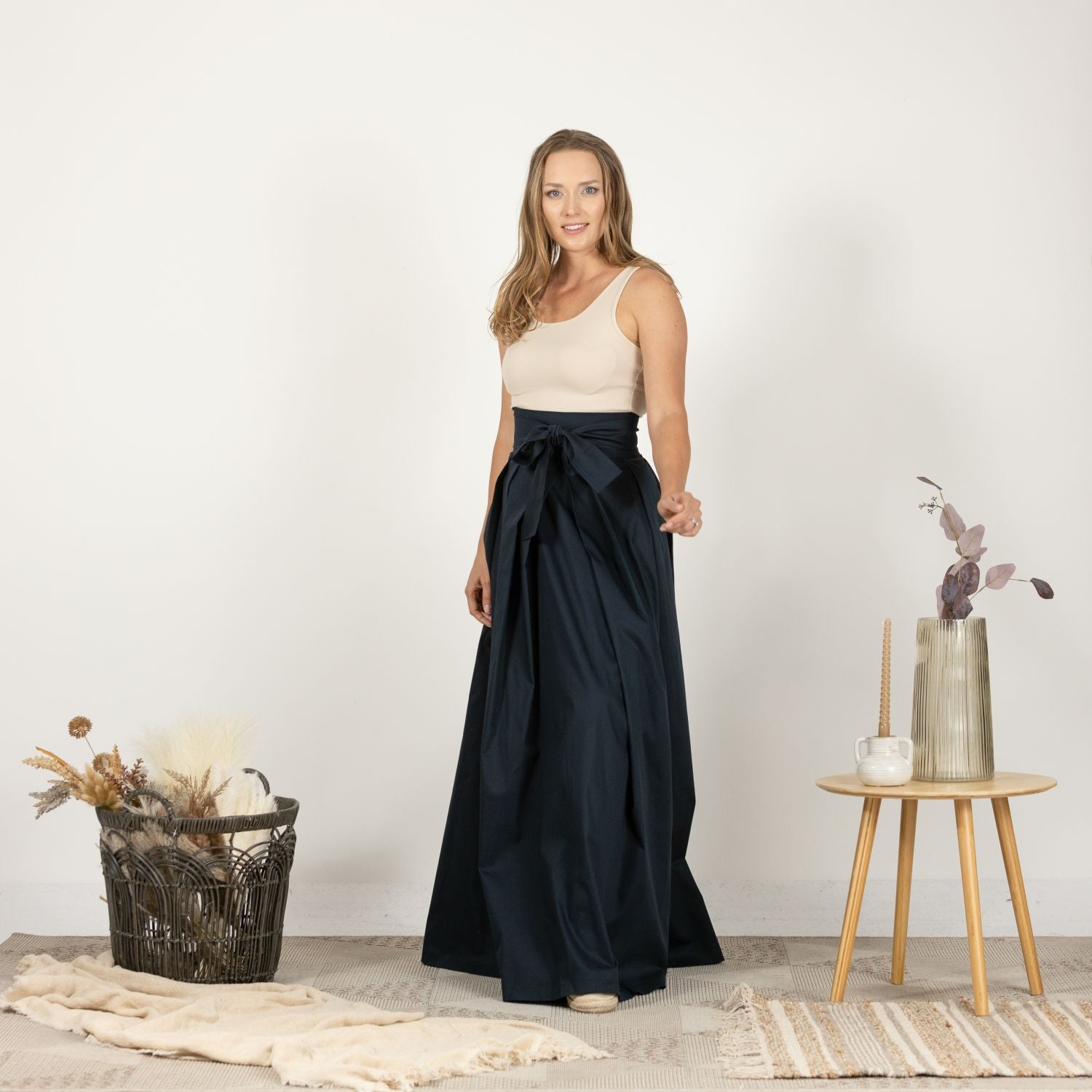 Front view of the High Waist Pleated Maxi Skirt in Dark Blue, featuring a classic pleated design and a high waist for an elegant, feminine silhouette.