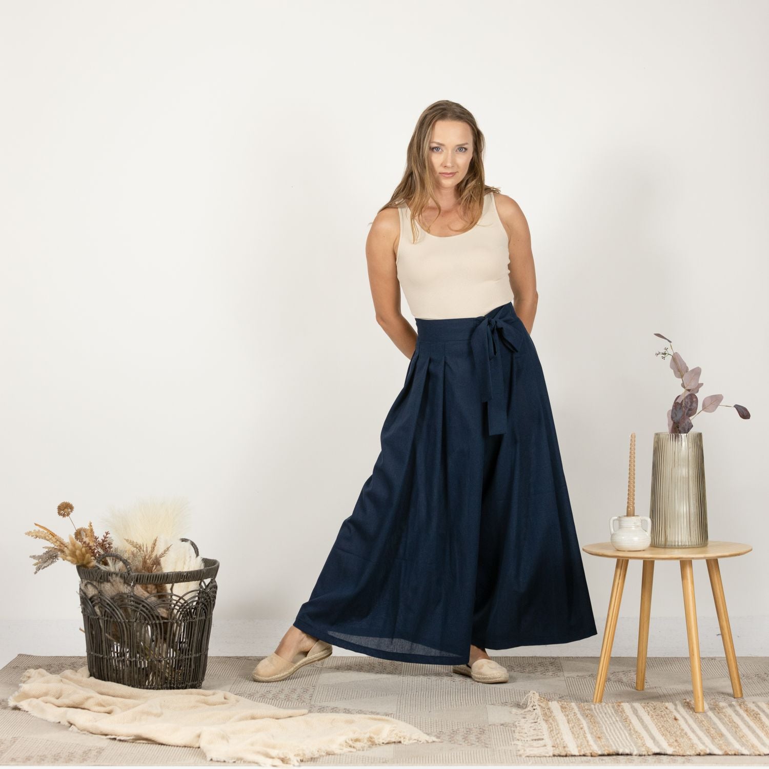 Close-up front view of the Dark Blue Melange Wide Leg Linen Pants, focusing on the premium Italian linen fabric and the sophisticated bow detail at the high waist.