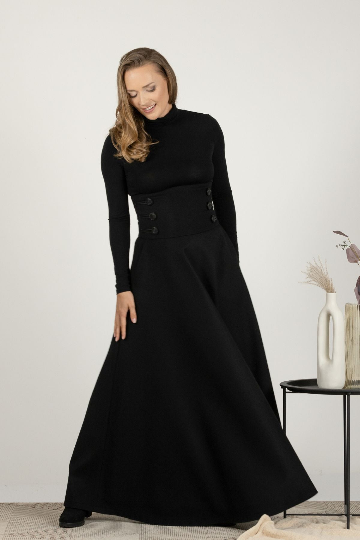 High-waisted black wool maxi with timeless design