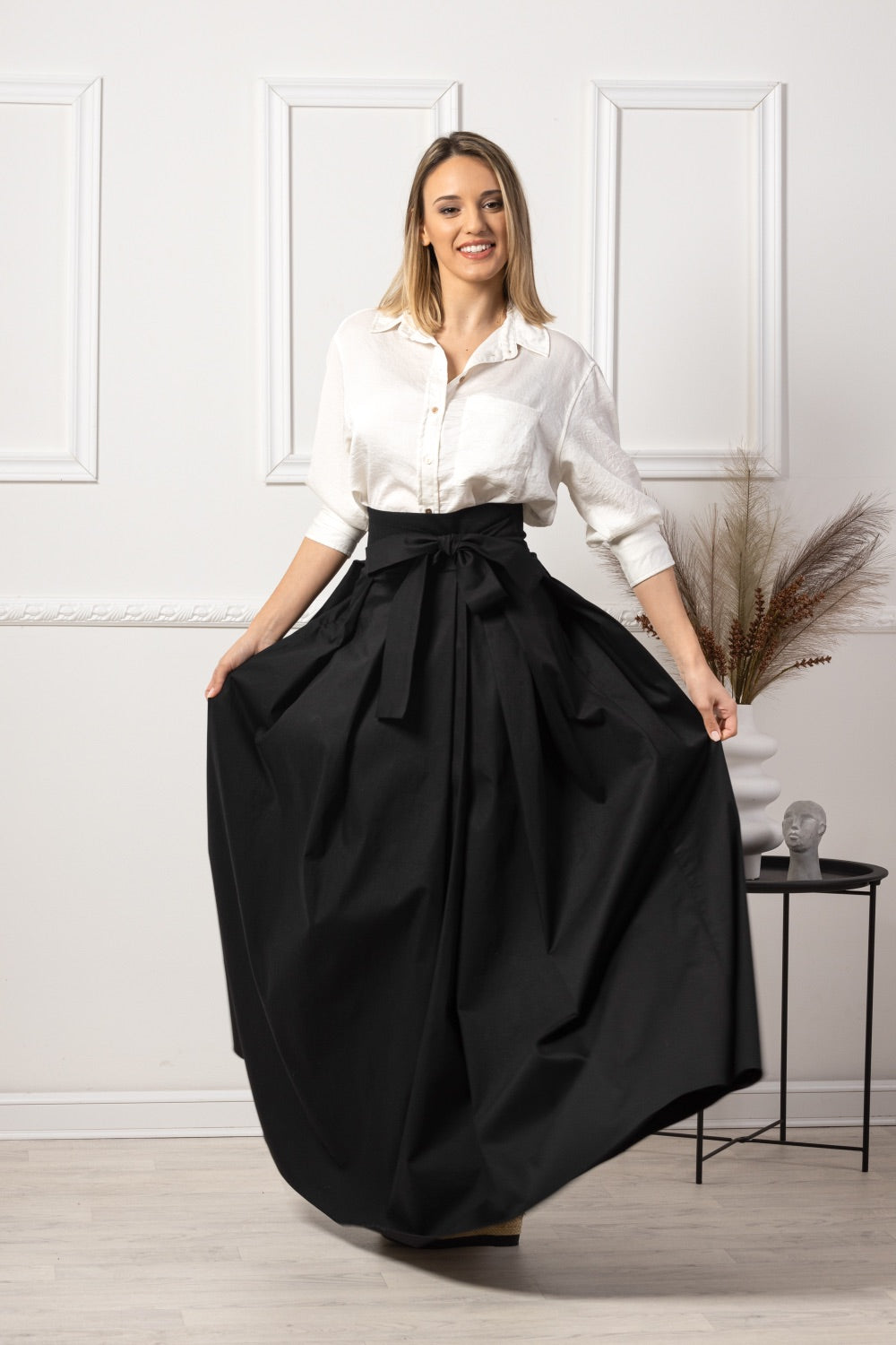 Black High Waist Pleated Maxi Skirt paired with heels - from NikkaPlace | Effortless fashion for easy living