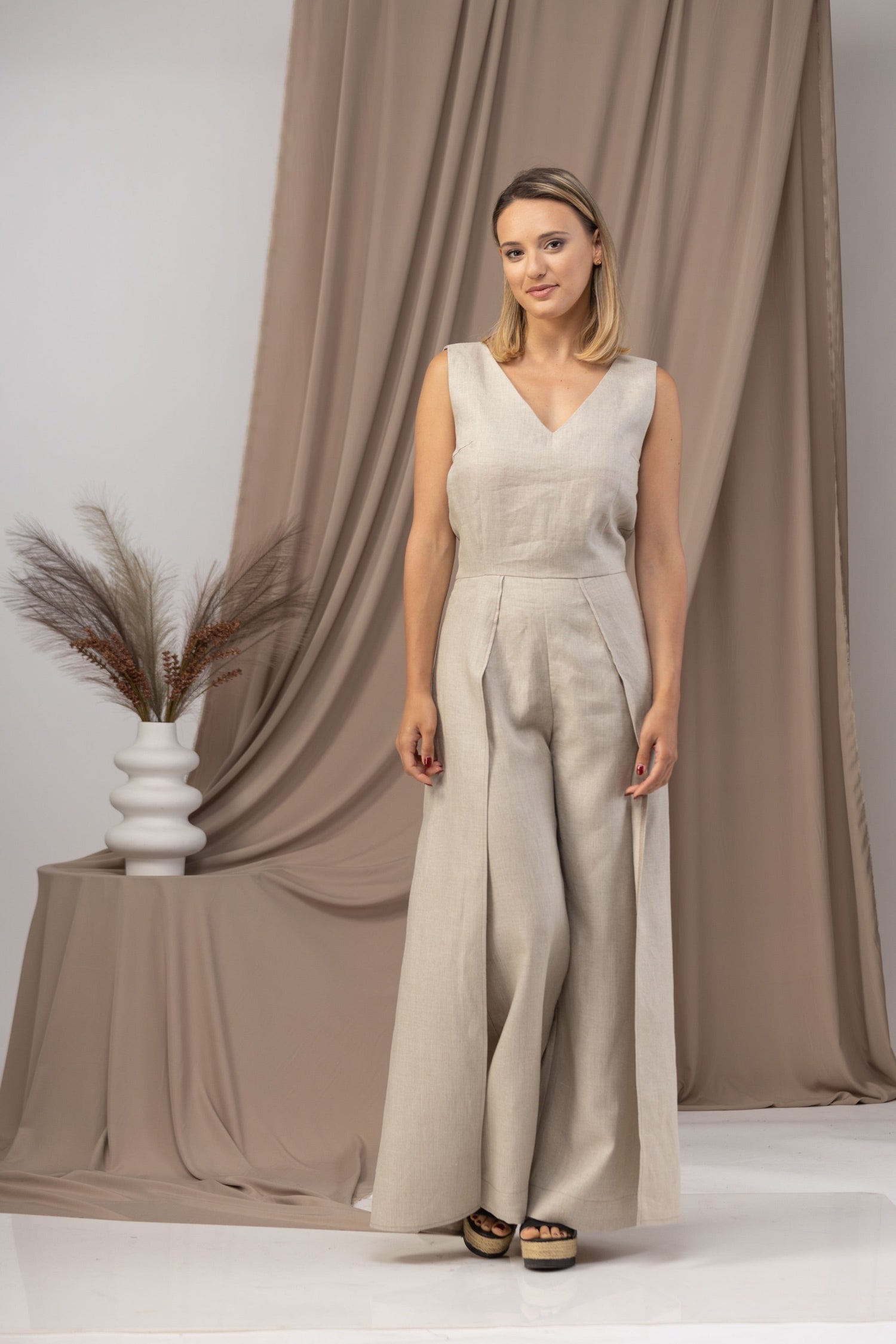 Elevate your summer wardrobe with our Linen Maxi Jumpsuit with Flaps - from NikkaPlace | Effortless fashion for easy living