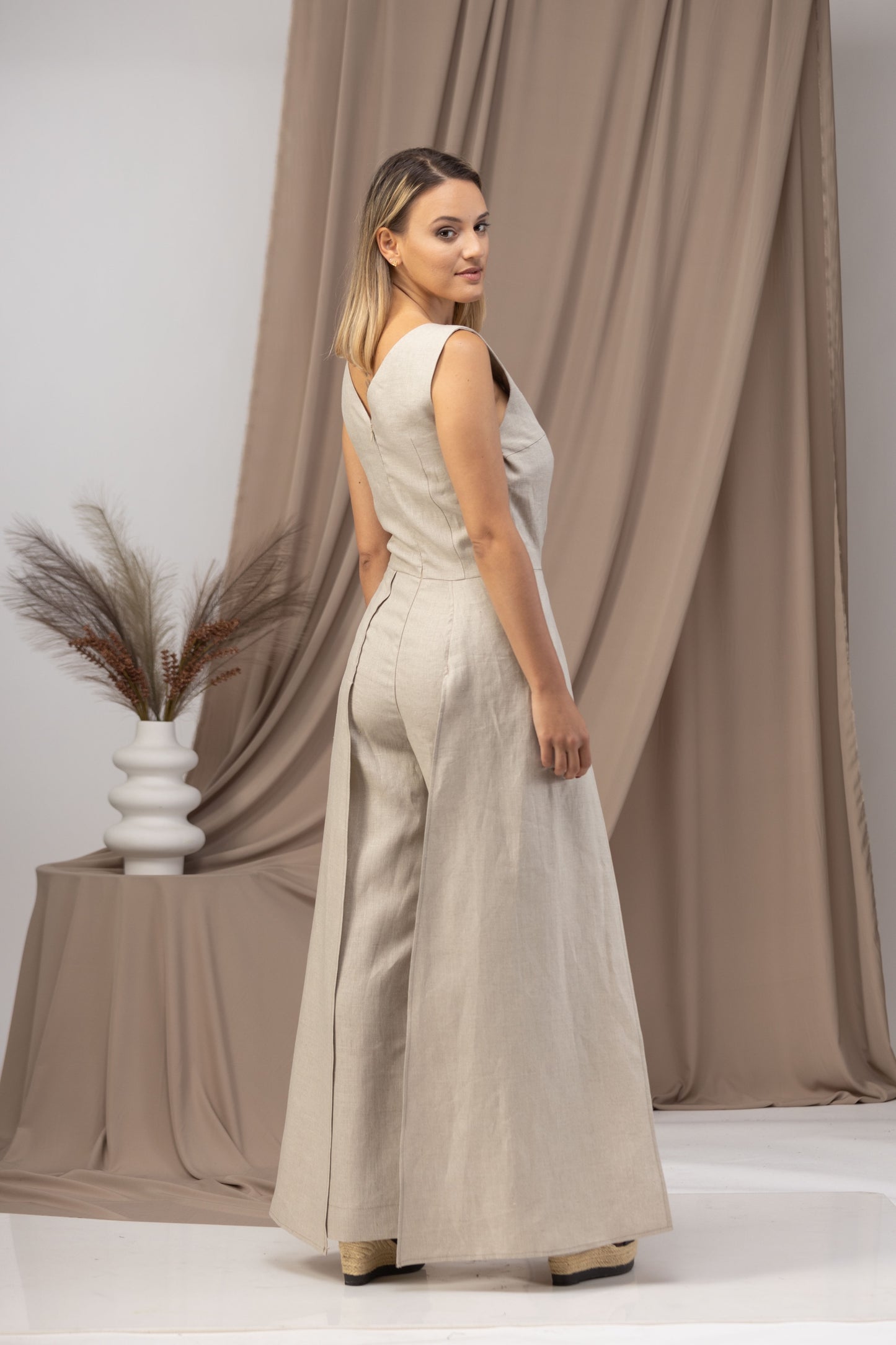 Stay cool and stylish in our Linen Maxi Jumpsuit with Flaps - from NikkaPlace | Effortless fashion for easy living