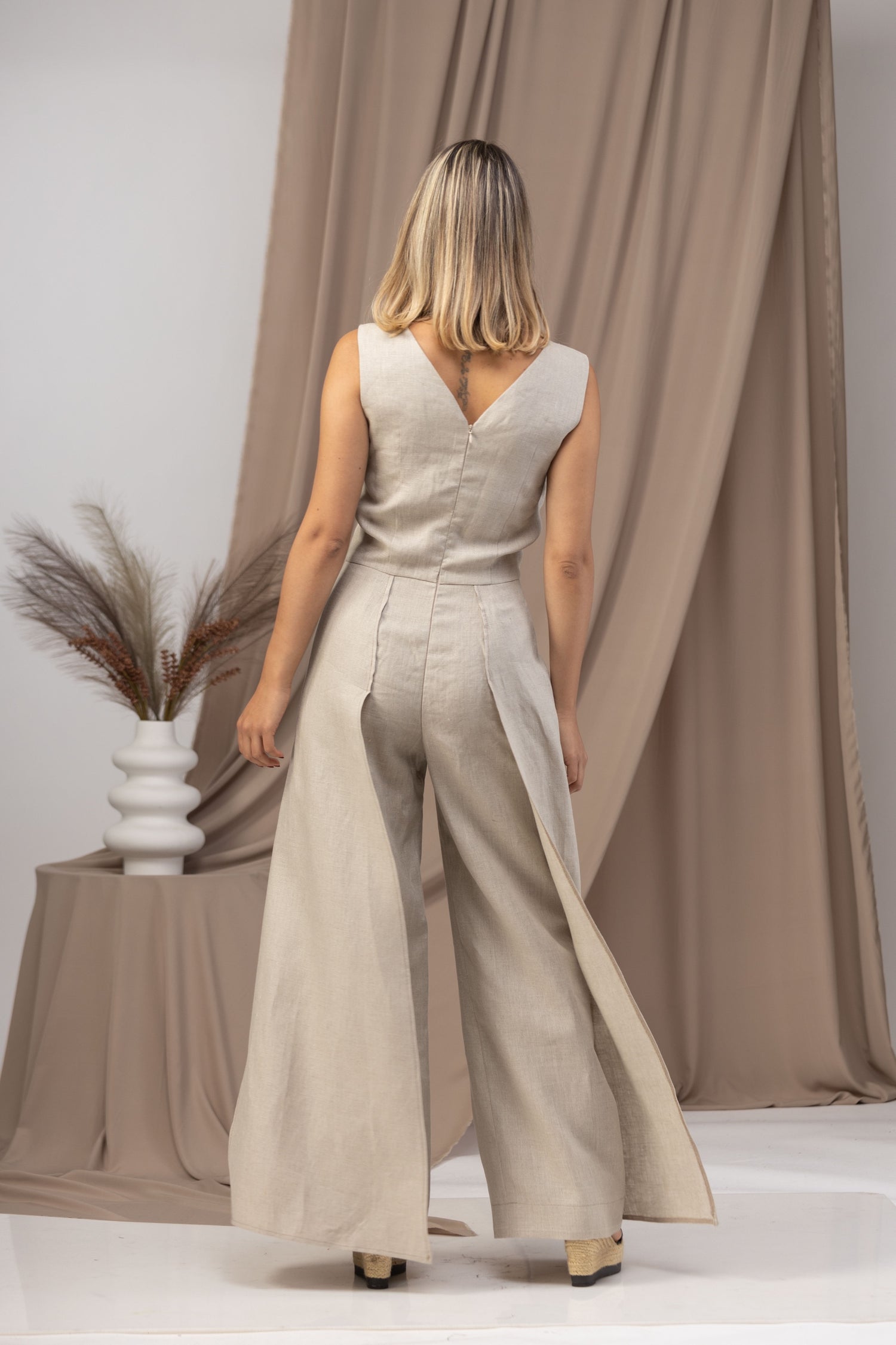 Linen Maxi Jumpsuit with Flaps in a flowy white fabric - from NikkaPlace | Effortless fashion for easy living
