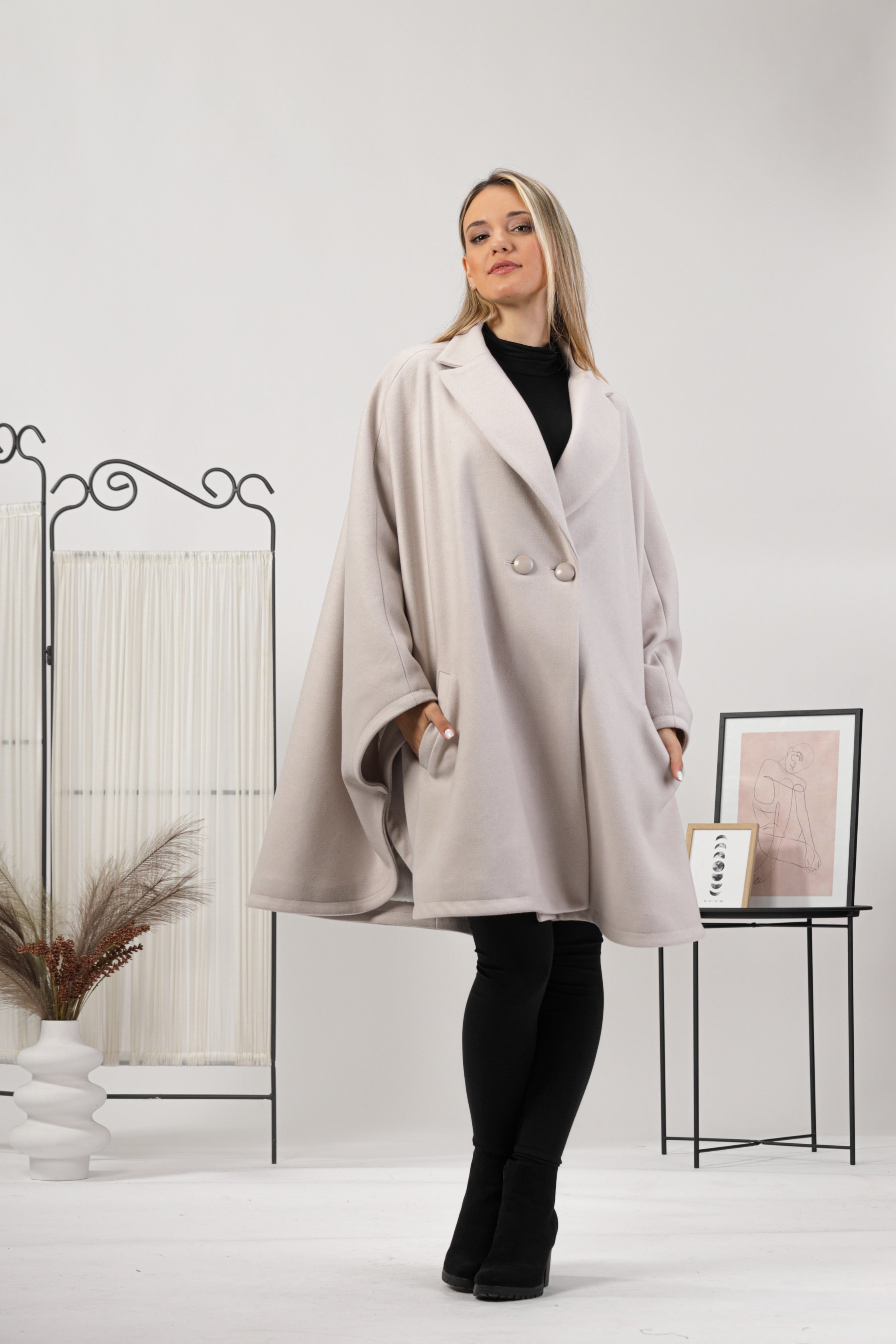 Effortless fashion and easy living with our Dark Navy Collared Cape Coat from NikkaPlace