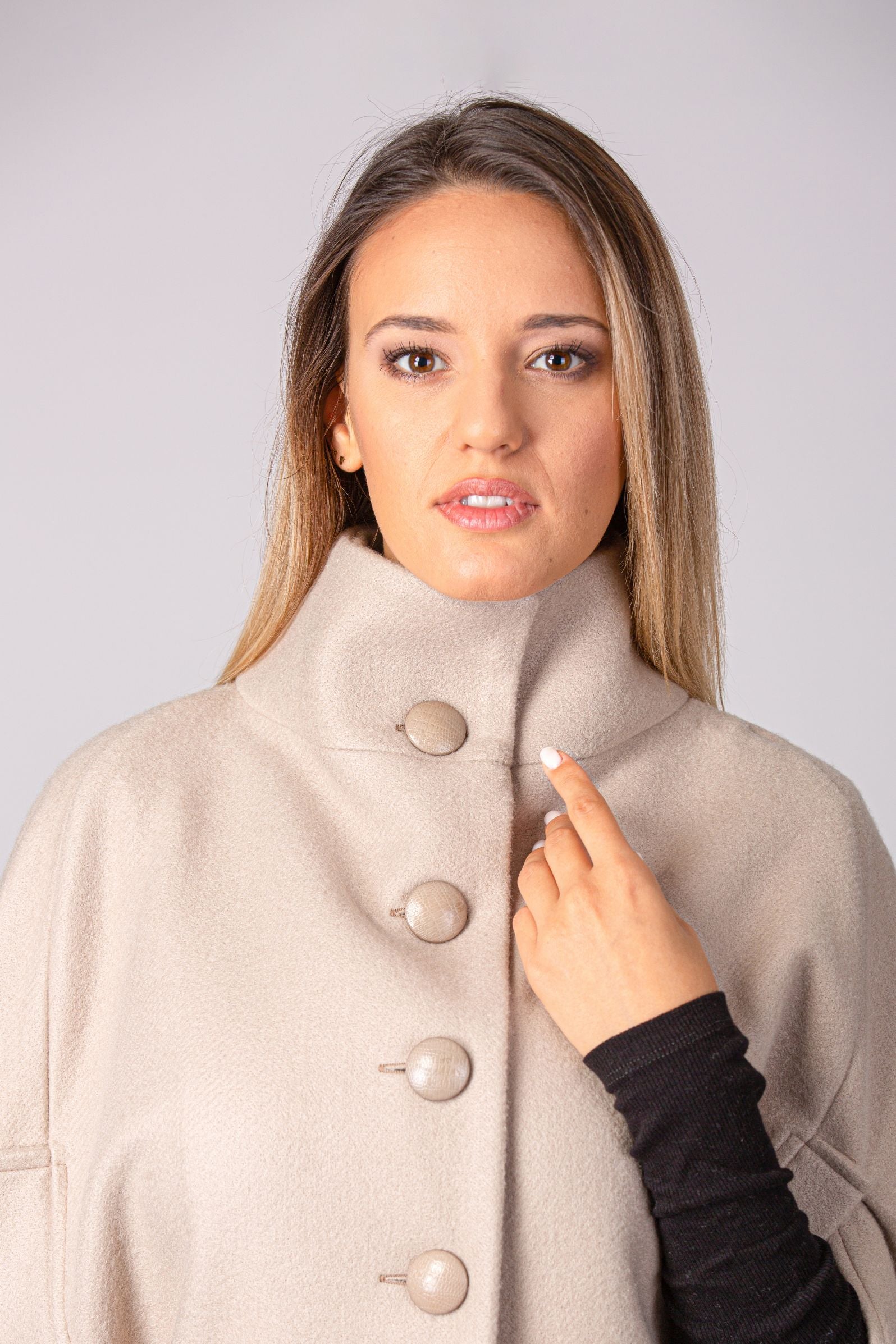 Close-up of the button closure on the Buttoned Poncho Coat - from NikkaPlace | Effortless fashion for easy living